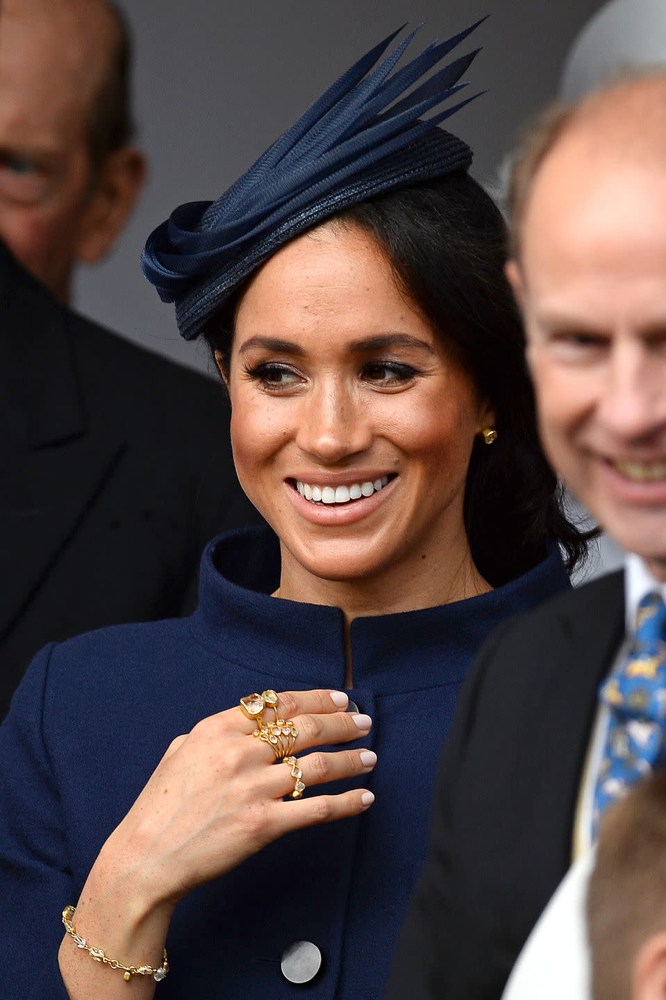 <p>Meghan layered up on gold rings for Princess Eugenie's 2018 wedding to Jack Brooksbank. </p>