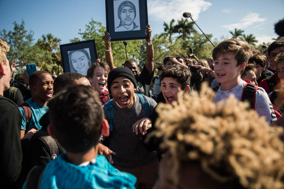 Students chant outside Marjory Stoneman Douglas High School during the walkout.