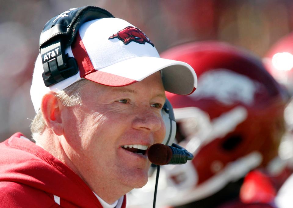 FILE - In this Oct. 22, 2011, file photo, Arkansas football coach Bobby Petrino smiles on the sidelines during the first half of an NCAA college football game in Oxford, Miss. It's got little buzz, features teams with major flaws and for all but 45 minutes will be broadcast opposite the No. 1-vs.-2 matchup between LSU and Alabama. Welcome to the Southeastern Conference's other top 10 showdown between No. 8 Arkansas and No. 10 South Carolina. (AP Photo/Rogelio V. Solis, File)