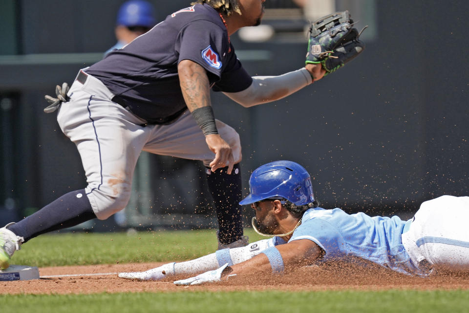 Kansas City Royals' MJ Melendez beats the tag by Cleveland Guardians third baseman Jose Ramirez after hitting an RBI triple during the third inning of a baseball game Monday, Sept. 18, 2023, in Kansas City, Mo. (AP Photo/Charlie Riedel)