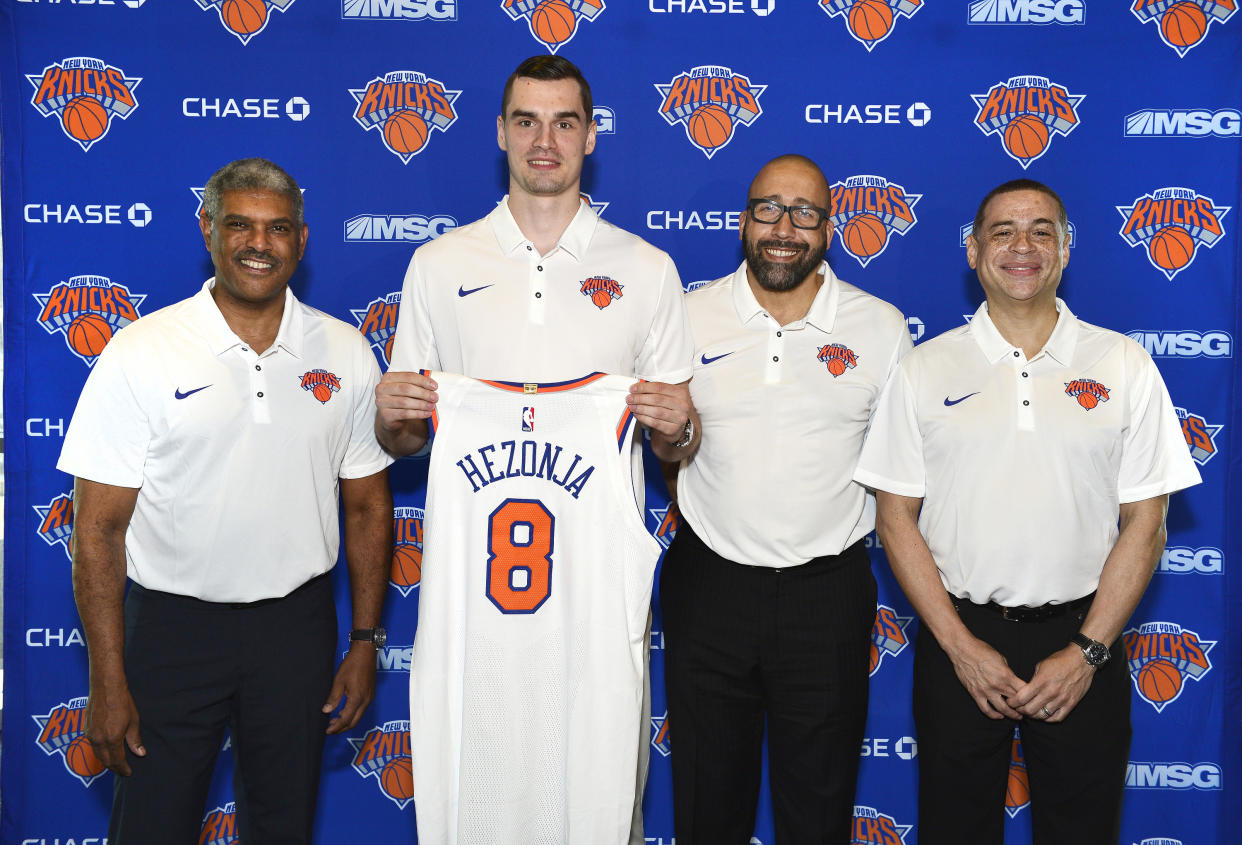 (From left) Knicks president Steve Mills, Mario Hezonja, coach David Fizdale and general manager Scott Perry are trying to turn the Knicks into winners. (Getty)