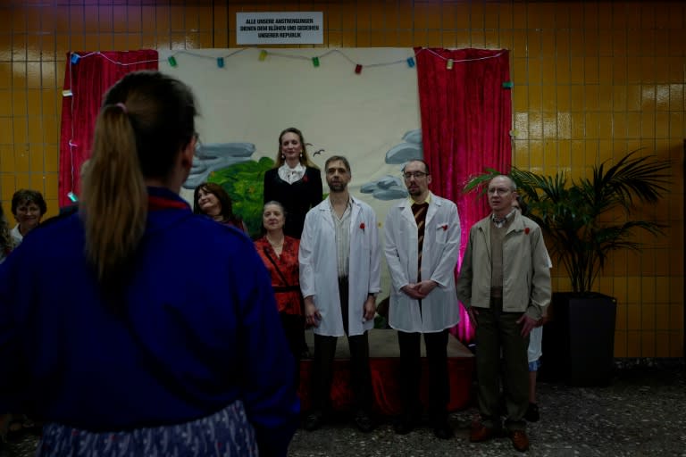 Participating actors sing an East German patriotic song during 'Socialist revival live cinema event', in Berlin