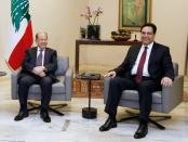 Designated Prime Minister Hassan Diab meets with Lebanon's President Michel Aoun at the presidential palace in Baabda