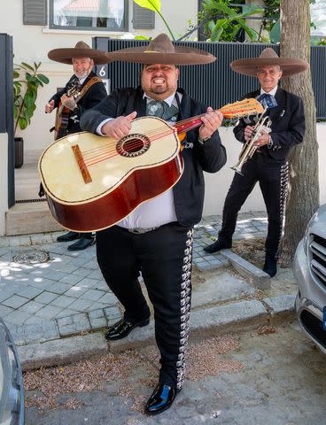 <p>MEGA</p> A mariachi band serenading Amber Heard on April 22, 2024