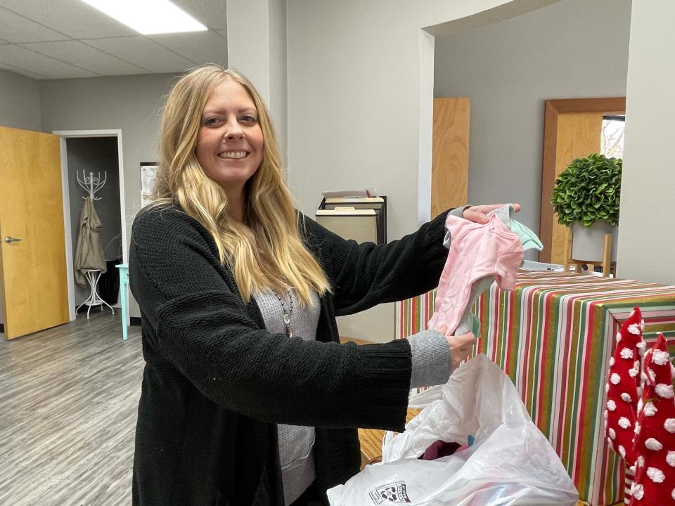 Caseworker Courtnie Mizer with Destiny Adoption Services stops by Helping Mamas Knoxville for a few essentials Dec. 27, 2022.