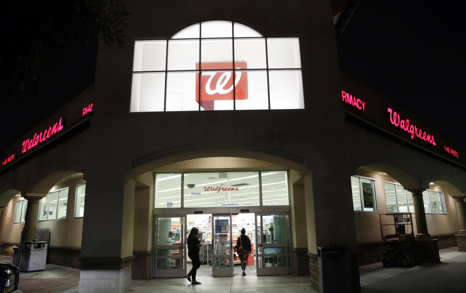 FILE - In this June 24, 2019 file photo, shoppers enter a Walgreens store in Los Angeles. Lawsuits filed by two Ohio counties against retail pharmacy chains CVS, Walgreens, Rite Aid, Walmart and Giant Eagle claiming their opioid dispensing practices flooded communities with pain pills and were a a public nuisance can continue after U.S. District Judge Dan Polster, a federal judge in Cleveland, denied the chains' motion to dismiss the complaints in a ruling Thursday, Aug. 6, 2020. (AP Photo/Marcio Jose Sanchez, File)