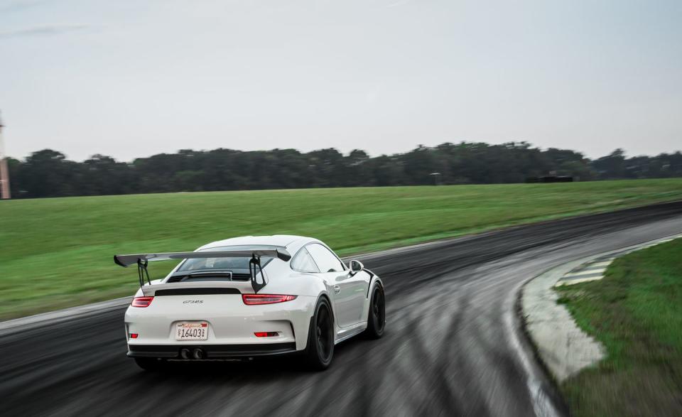 <p>Horsepower: 500; Weight: 3155 lb; Price as tested: $195,020<br><br></p><p>It’s not as scary as it looks. Everything that makes the Porsche 911 GT3 RS intimi­dating-the tires that barely fit, the shark gills on the fenders, the ironing board hanging off the tail-makes for a friendlier car on the track. The tires, vents, and that wing work to make your palms just a bit less sweaty as you nose the $189,760 GT3 RS into the fast Climbing Esses at 137 mph. <a rel="nofollow noopener" href="http://www.caranddriver.com/features/porsche-911-gt3-rs-at-lightning-lap-2016-feature" target="_blank" data-ylk="slk:READ MORE ››;elm:context_link;itc:0;sec:content-canvas" class="link ">READ MORE ››</a></p>