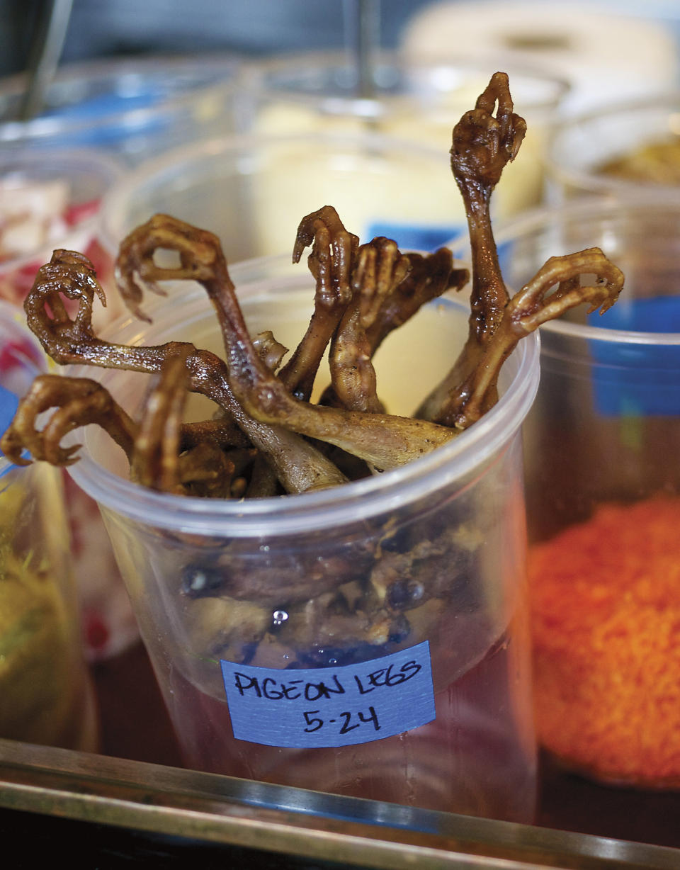 This undated image released by Le Pigeon shows pigeon legs used in dishes at Le Pigeon restaurant in Portland, Ore., where the rustic French-inspired food simply astounds. (AP Photo/Le Pigeon, David Reamer)