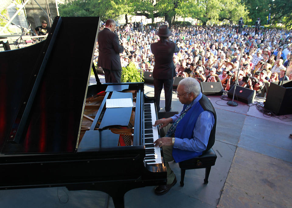 Pianist Ellis Marsalis performs with Kermit Ruffins and Dr. Michael White, left, at a sunrise concert marking International Jazz Day in New Orleans, Monday, April 30, 2012. The performance, at Congo Square near the French Quarter, is one of two in the United States Monday; the other is in the evening in New York. Thousands of people across the globe are expected to participate in International Jazz Day, including events in Belgium, France, Brazil, Algeria and Russia. (AP Photo/Gerald Herbert)