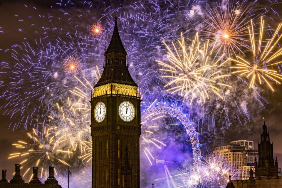 Fireworks light up the London skyline over Big Ben and the London Eye on New Years Eve
