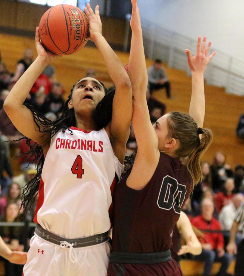 Newark Valley's Makana Gardner goes up for a shot as Delhi's Julia Baxter defends during the Cardinals' 59-19 win in the Section 4 Class C girls basketball championship game March 5, 2022 at SUNY Cortland.