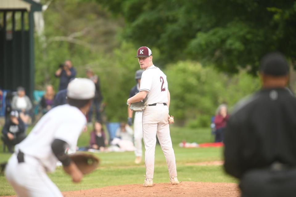 Killingly pitcher Jay Grzysiewicz checks the runner at first base during Killingly's 8-1 win against Rocky Hill in the Class M state tournament at Ben Desaulnier Field.. 
(Photo: [John Shishmanian/ NorwichBulletin.com])