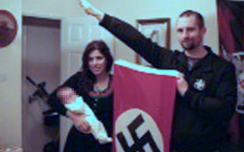 Picture shown to jurors showing Darren Fletcher who has admitted being a member of banned far-right terrorist group National Action, posing with alleged member Claudia Patatas and her baby, at her home in Waltham Gardens, Banbury, Oxfordshire.  - Credit:  West Midlands Police/PA