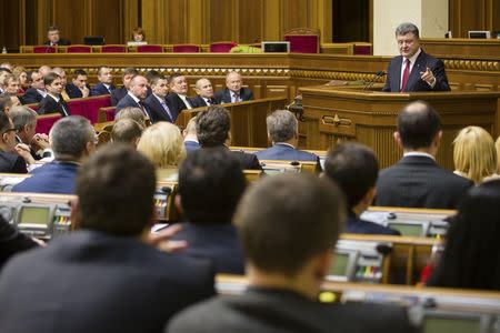 Ukraine's President Petro Poroshenko (R, top) delivers a speech during a session of the parliament in Kiev, November 27, 2014. Petro Poroshenko said on Thursday 100 percent of Ukrainians were in favour of a having single state, without federalisation, in a keynote address to the first session of a new parliament. REUTERS/Mikhail Palinchak/Ukrainian Presidential Press Service/Handout via Reuters