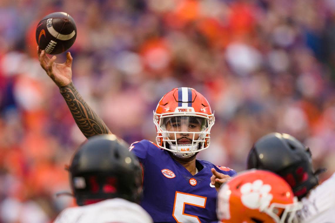 Clemson quarterback DJ Uiagalelei (5) passes the ball in the first half of an NCAA college football game against Louisville, Saturday, Nov. 12, 2022, in Clemson, S.C. (AP Photo/Jacob Kupferman)