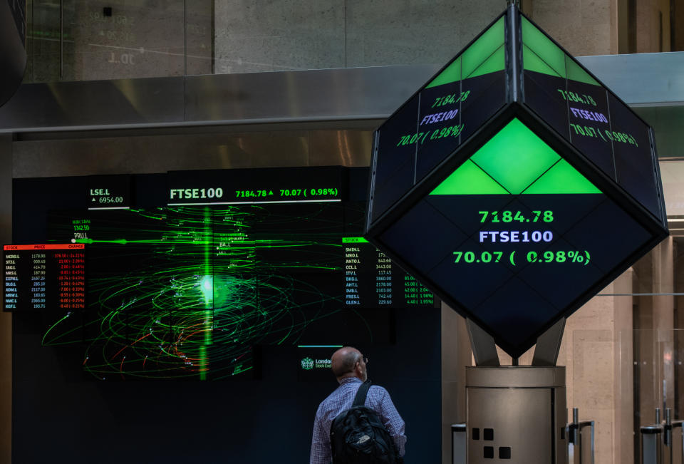 LONDON, ENGLAND - AUGUST 29: Financial market figures are shown on big screens and a ticker in the main entrance at London Stock Exchange on August 29, 2019 in London, England. The pound has come under renewed pressure after the government moved to prorogue parliament for five weeks, fueling fears of a no-deal Brexit. (Photo by Chris J Ratcliffe/Getty Images)