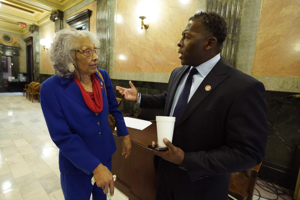 CORRECTS ELECTION YEAR TO 1985, NOT 1984 - State Rep. Alyce Clarke, D-Jackson, confers with state Rep. Chris Bell, D-Jackson about a committee meeting at the Mississippi Legislature, Tuesday, Jan. 31, 2023, in Jackson, Miss. Clarke, who was first elected to the House in 1985, announced Tuesday that she will not seek reelection. She was the first African American woman elected to the Legislature. (AP Photo/Rogelio V. Solis)