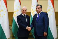 DUSHANBE, TAJIKISTAN - FEBRUARY 17: British Minister of State for International Development Desmond Swayne (L) shakes hands with Tajikistan's President Emomali Rahmon (R) during his official visit in Dushanbe, Tajikistan on February 17, 2016. (Photo by Tajikistan Presidency Press Office/Anadolu Agency/Getty Images)