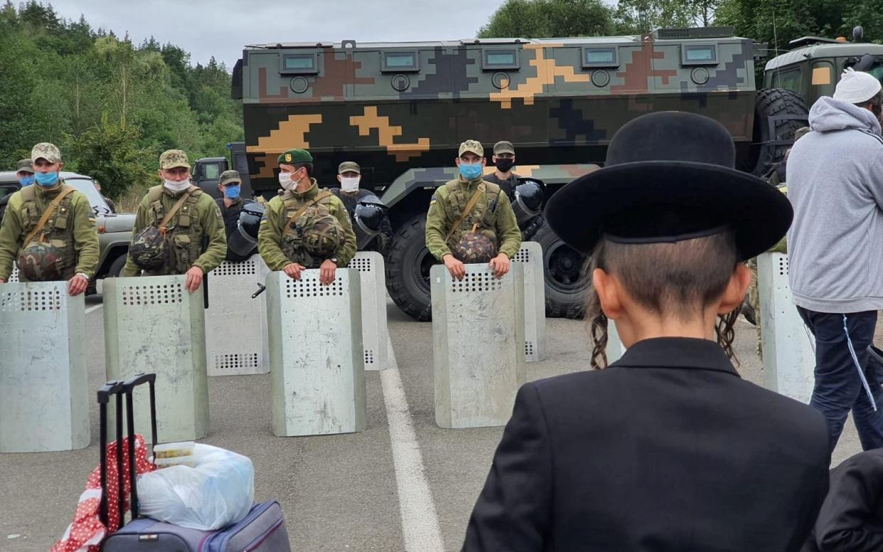 Jewish pilgrims have been stranded at the Ukrainian-Belarusian border since Monday - Breslev live/Reuters
