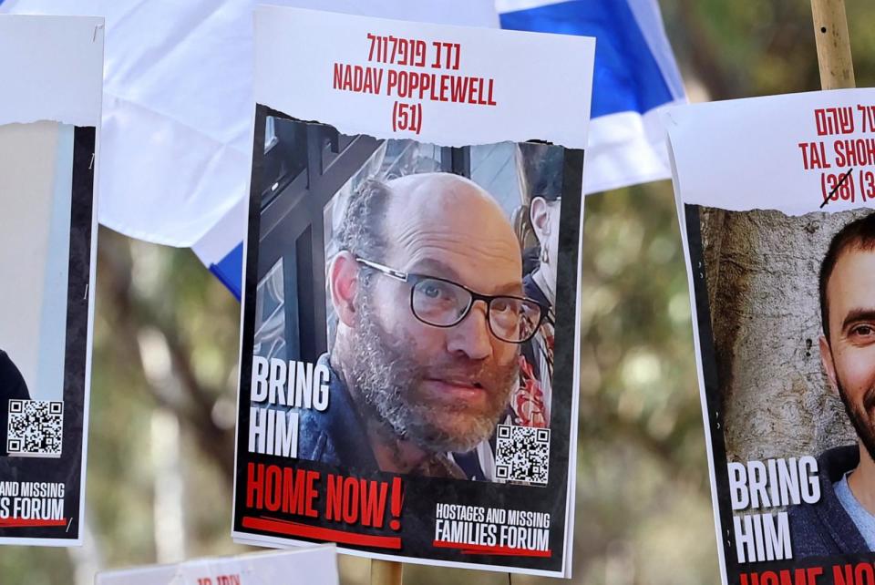 PHOTO: A poster portrait of hostage Nadav Popplewell is seen as relatives and supporters of Israeli captives held in Gaza since the Oct. 7 attacks by Hamas militants call for their release, on Feb. 28, 2024. (Jack Guez/AFP via Getty Images, FILE)