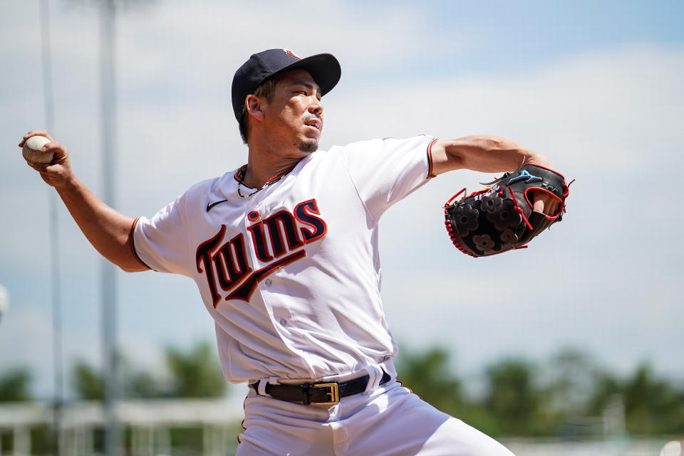 Kenta Maeda pitches prior to a spring training game.