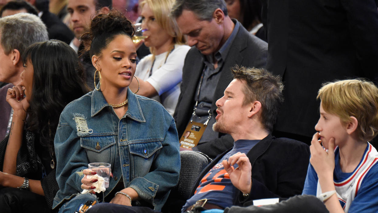  Ethan Hawke and Rihanna at a basketball game together 