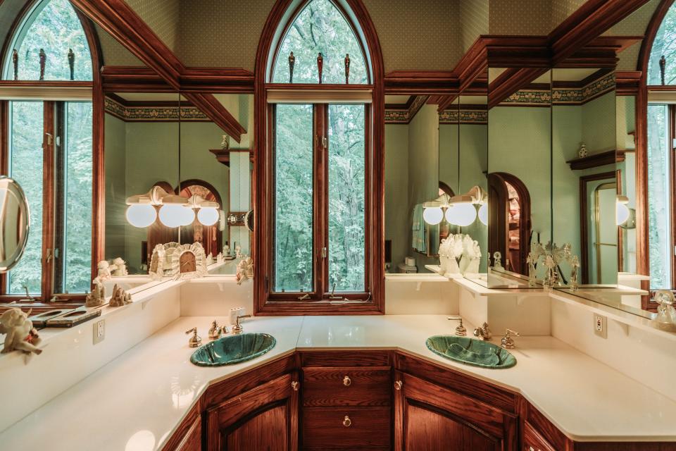 Arched windows in one of five full bathrooms in LeBlanc Castle, Michigan.