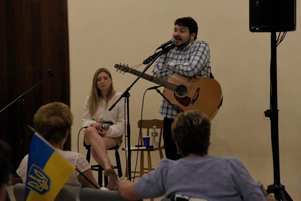 Hanna Datsko and Jason Wojnar sing Ukrainian songs during an Orthodox Easter Fundraiser on Friday, April 14, 2023 at the Unitarian Universalist meeting house in Middletown, New Jersey. Wojnar met David Halbout at a New York City event that showcased photos of the 2022 Russian invasion of Ukraine. 