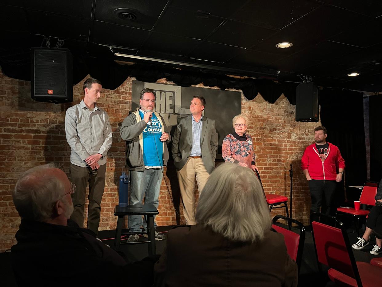 Monroe County Council candidates Matt Caldie, David Henry, Trent Deckard and Cheryl Munson answer a question about housing affordability at the Comedy Attic on March 20, 2024.