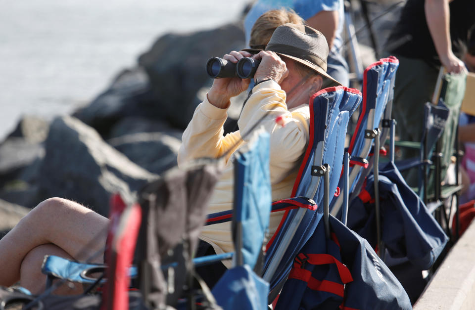 <p>Visitors stake out spots near the fishing pier at Jetty Park to watch SpaceX’s first Falcon Heavy rocket launch from the Kennedy Space Center, Fla., Feb. 6, 2018. (Photo: Gregg Newton/Reuters) </p>