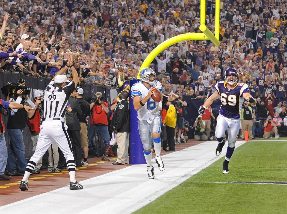 MINNEAPOLIS - OCTOBER 12:  Jared Allen #69 of the Minnesota Vikings chases Dan Orlovsky #6 of the Detroit Lions out of bounds for a safety during an NFL game at the Hubert H. Humphrey Metrodome, October 12, 2008 in Minneapolis, Minnesota.  (Photo by Tom Dahlin/Getty Images)