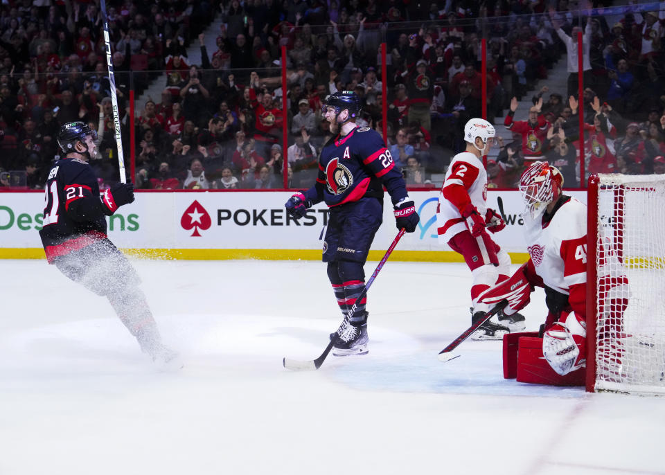 Ottawa Senators right wing Claude Giroux (28) celebrates teammate Mathieu Joseph (21) after his goal against Detroit Red Wings goaltender Magnus Hellberg (45) during second-period NHL hockey game action in Ottawa, Ontario, Monday, Feb. 27, 2023. (Sean Kilpatrick/The Canadian Press via AP)