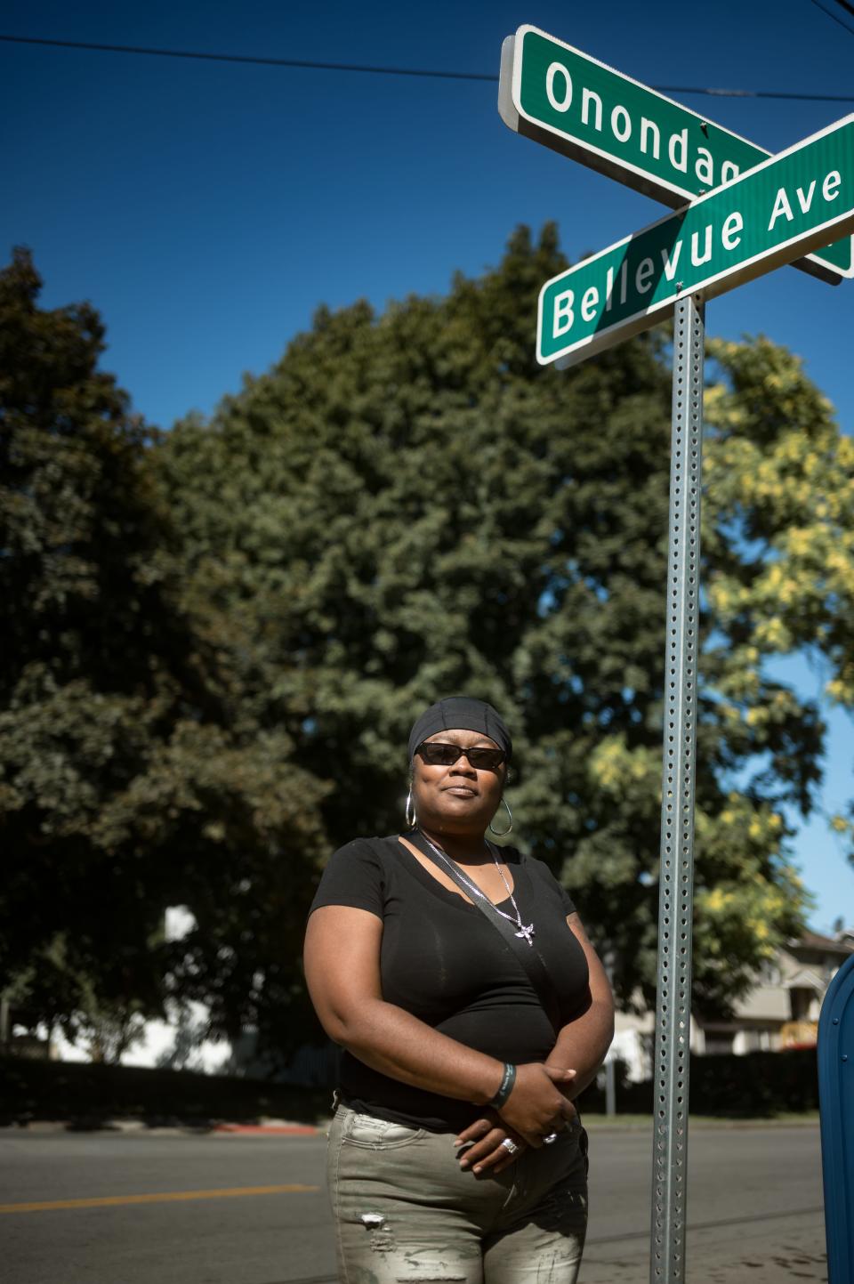 Deshane Levere stands at the intersection of Onondaga Avenue and Bellevue Avenue in Syracuse, NY on Friday, September 15, 2023. A decade prior, a Syracuse police cruiser ran a redlight and crashed into Levere's four-door sedan, injuring her back.