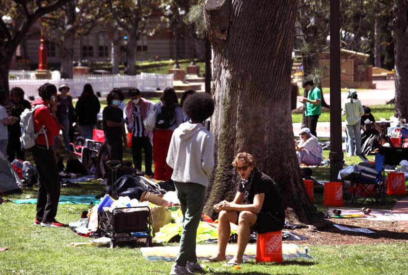 LOS ANGELES, CA - APRIL 27, 2024 - USC students, who protest the war in Gaza, spend time at the tent camp they erected at Founders Park on the USC campus in Los Angeles on April 27, 2024. The campus gates are closed to the public and the marquee 65,000-attendee "main stage" commencement ceremony has been called off. (Genaro Molina/Los Angeles Times)