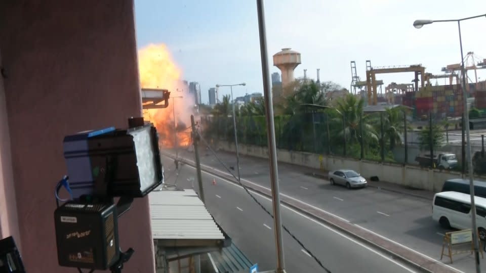 An explosion went off on Monday in a van near a church in Sri Lanka where scores were killed the previous day, when bomb squad officials were trying to defuse it, a Reuters witness said. Rough cut (no reporter narration).