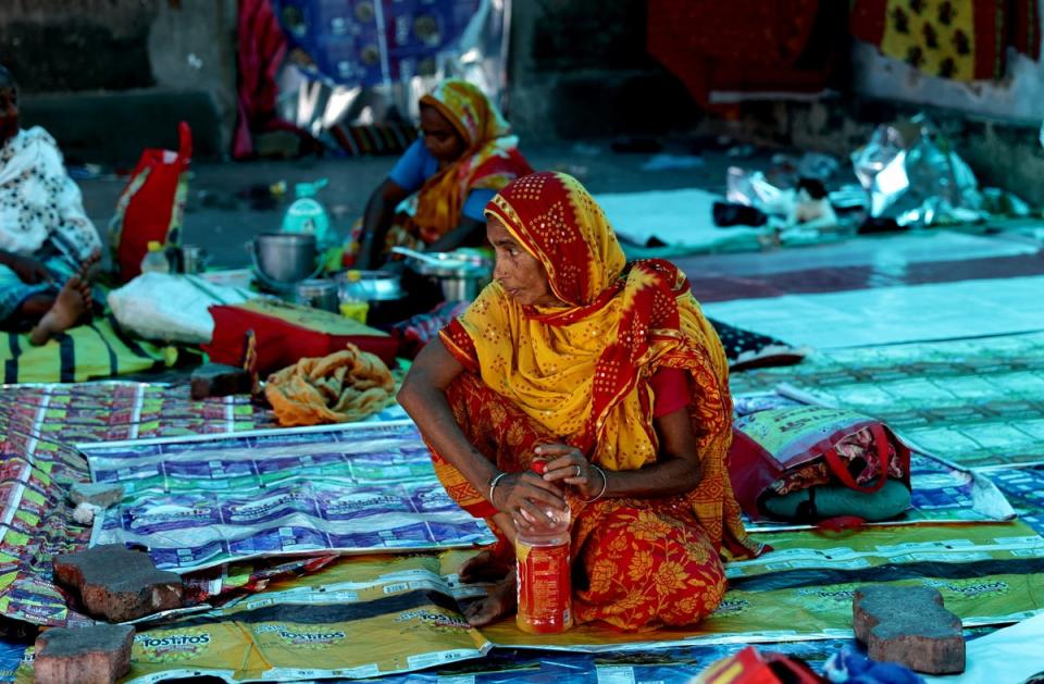 Relatives of patients wait as the medical students and doctors attend a protest in Kolkata, India, on 17 August 2024 (EPA)