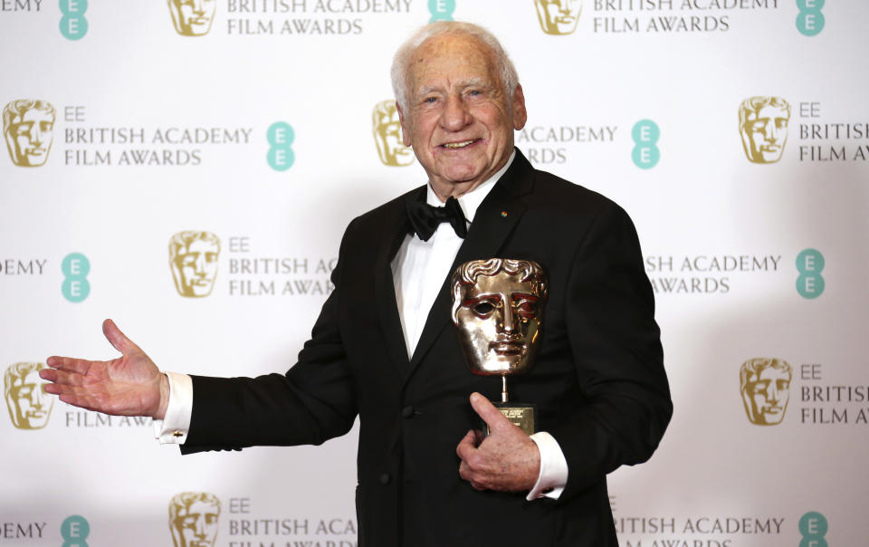 FILE - In this Feb. 12, 2017 file photo, Mel Brooks poses for photographers with his BAFTA Fellowship award backstage at the British Academy Film Awards in London. Brooks turns 94 on June 28. (Photo by Joel Ryan/Invision/AP, File)