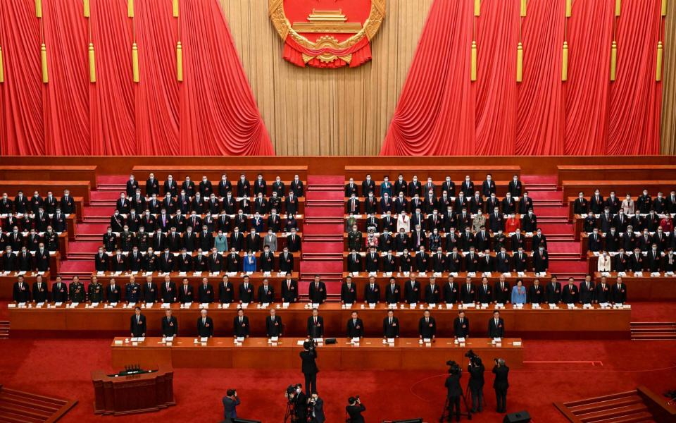 China's leaders at the opening session of the National People's Congress - NOEL CELIS/AFP