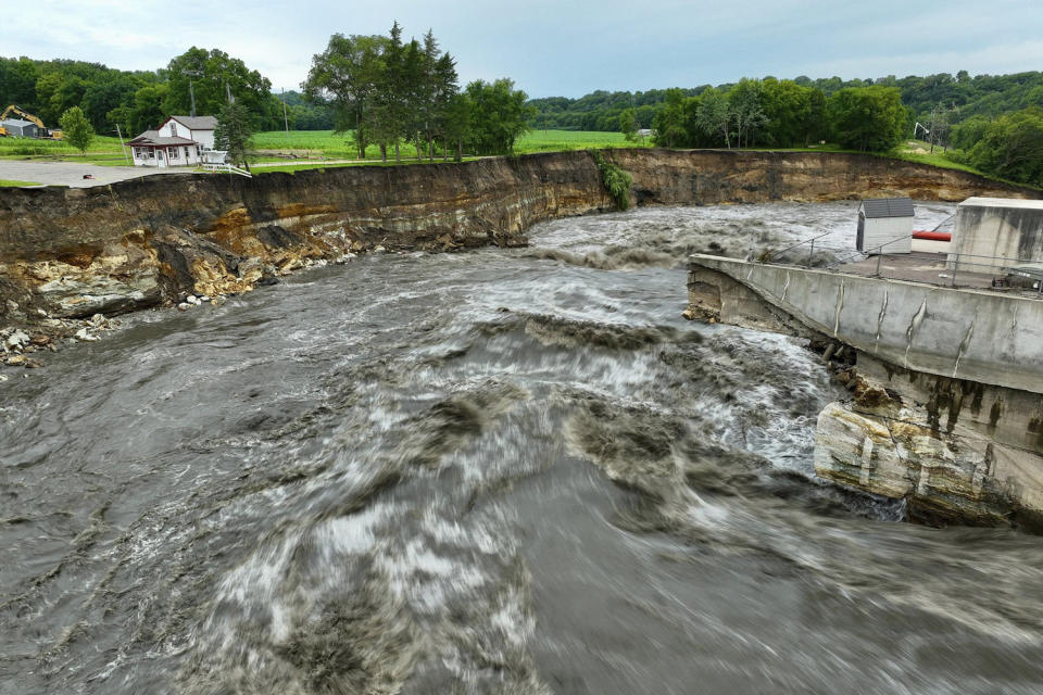 Floodwater continues to carve a channel around the Rapidan Dam, near Mankato, Minn. (Mark Vancleave / AP)