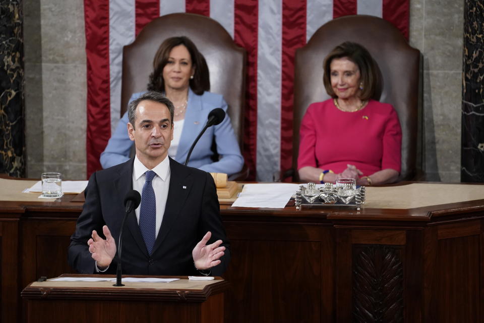 Speaker of the House Nancy Pelosi of Calif., right, and Vice President Kamala Harris, left, listen as Greek Prime Minister Kyriakos Mitsotakis delivers remarks to a joint session of Congress, Tuesday, May 17, 2022, in Washington. (AP Photo/Evan Vucci)