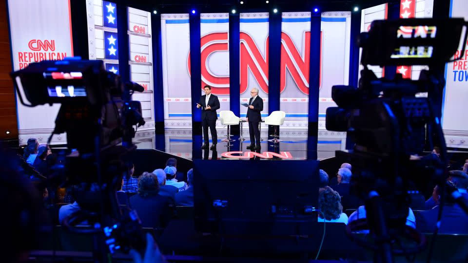 Florida Gov. Ron DeSantis, left, participates in a CNN Republican presidential town hall moderated by Wolf Blitzer, right, at New England College in Henniker, New Hampshire, on January 16, 2024. - Will Lanzoni/CNN