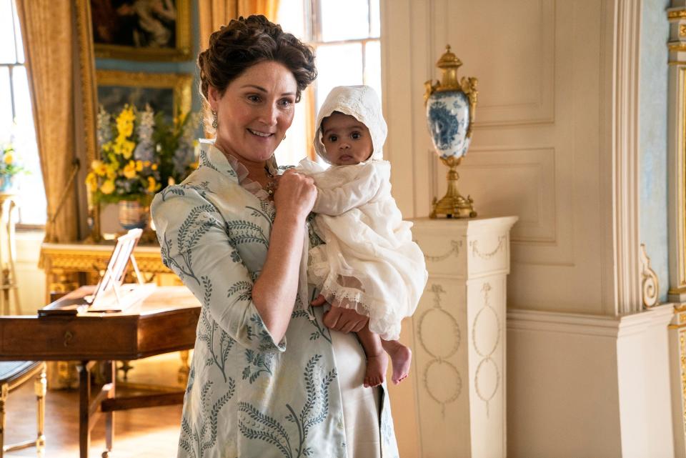 L-R: Ruth Gemmell as Lady Violet Bridgerton, Arianna and Ava Gittens-Roberts as Baby Augie in Season 2 of "Bridgerton".