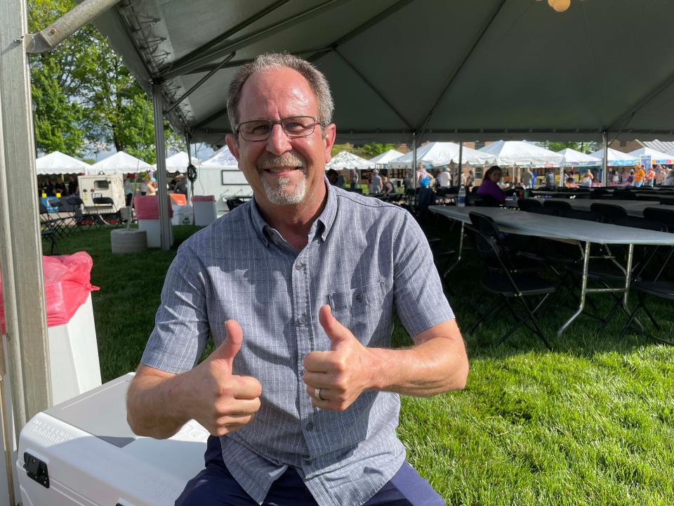 John Volpe, chief development officer for Remote Area Medical, takes a breather to listen to the music during the Southern Tequila and Taco Fest at Mayor Ralph McGill Plaza in Farragut on April 28, 2023.