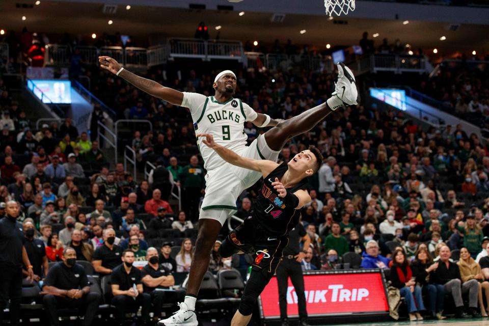 Heat guard Tyler Herro commits a flagrant foul while defending Bucks forward Bobby Portis during the third quarter at Fiserv Forum on Saturday night.