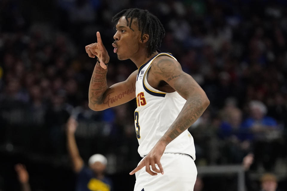 Denver Nuggets guard Bones Hyland gestures after scoring during the fourth quarter of an NBA basketball game against the Dallas Mavericks in Dallas, Sunday, Nov. 20, 2022. (AP Photo/LM Otero)