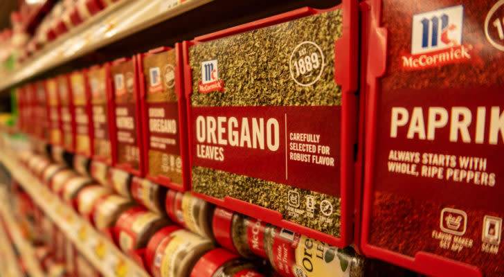 McCormick & Company spices lined up on a grocery store shelf.