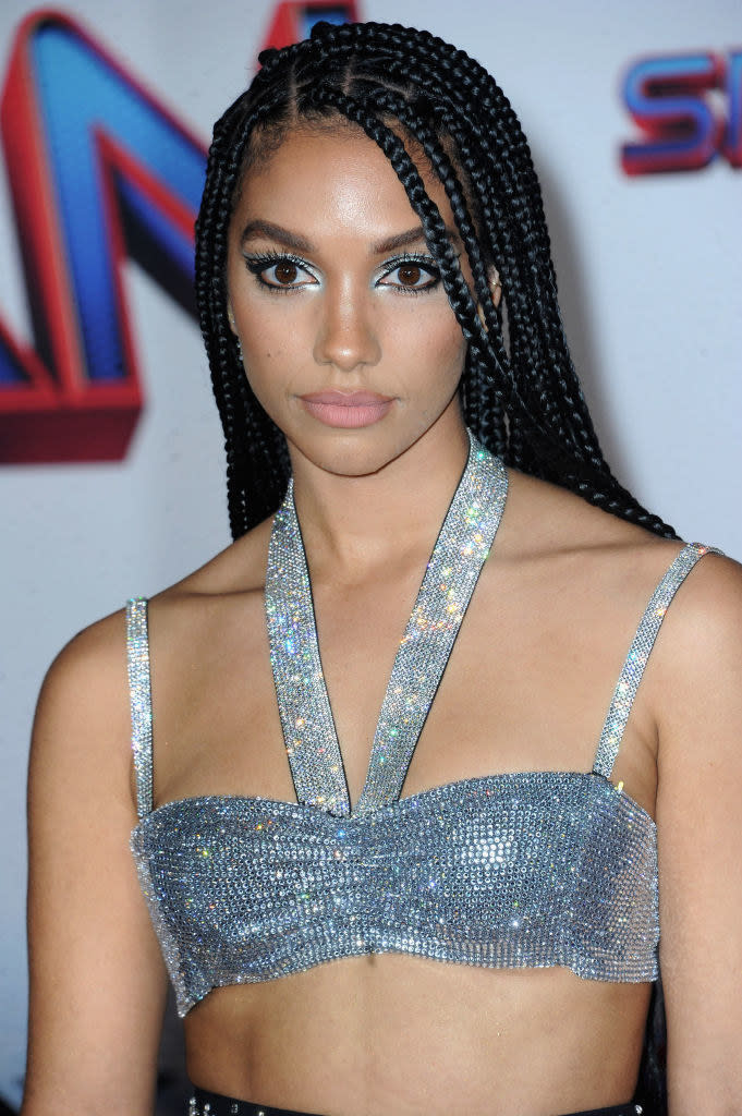 Corinne Foxx in long braids and sparkly tube top at the "Spider-Man: No Way Home" premiere