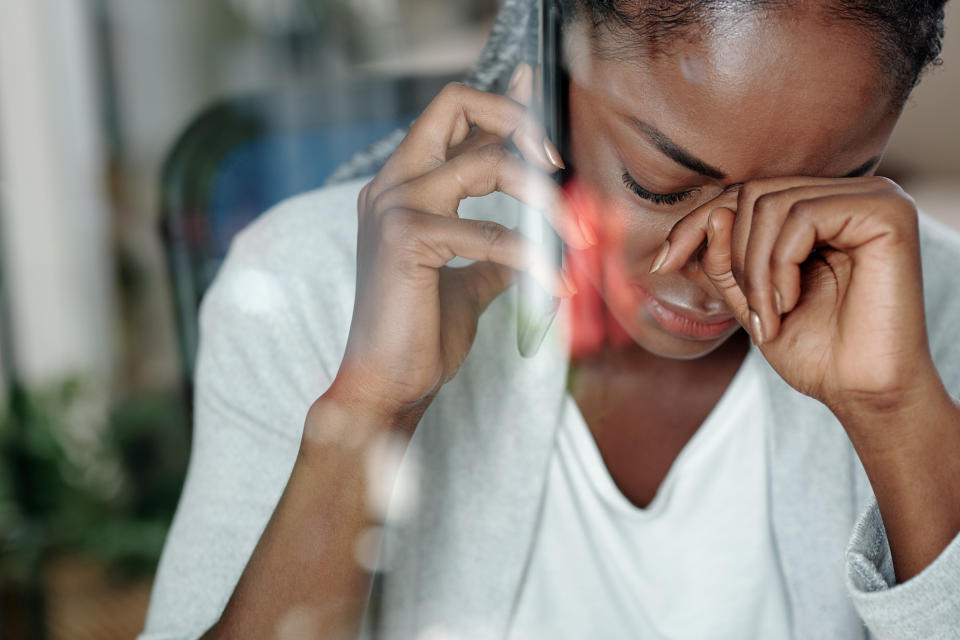 Distressed woman on the phone