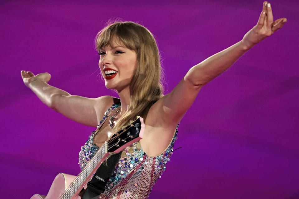 <p>Ashok Kumar/TAS24/Getty</p> Taylor Swift performs in Singapore in March 2024