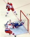 May 8, 2015; New York, NY, USA; Washington Capitals left wing Curtis Glencross (22) scores a goal against New York Rangers goalie Henrik Lundqvist (30) in front of Washington Capitals center Brooks Laich (21) during the third period of game five of the second round of the 2015 Stanley Cup Playoffs at Madison Square Garden. Mandatory Credit: Brad Penner-USA TODAY Sports